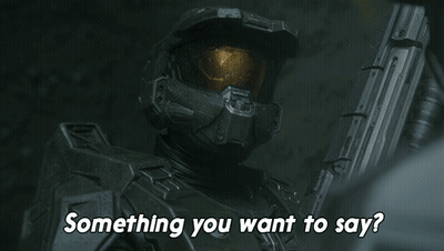 A Man In A Helmet Is Holding A Gun And Asking Something You Want To Say GIF