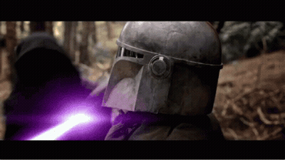 A Man In A Helmet Is Holding A Purple Lightsaber GIF
