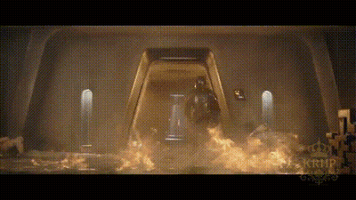 A Man In A Helmet Is Standing In Front Of A Door That Is On Fire . GIF