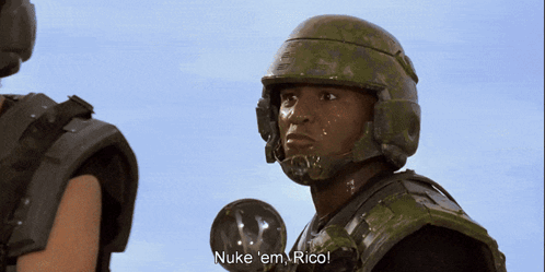 A Man In A Helmet Says " Nuke 'Em Rico " GIF