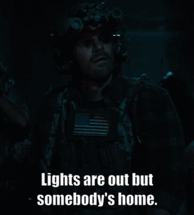 A Man In A Helmet With The Words Lights Are Out But Somebody 'S Home GIF