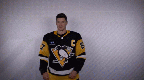 A Man In A Hockey Jersey With The Number 8 On It GIF