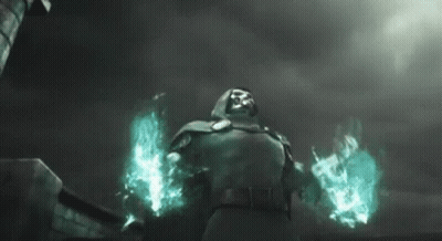 A Man In A Hood Is Standing In Front Of A Building And Holding A Torch . GIF