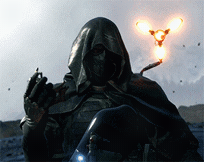 A Man In A Hooded Cape Is Holding A Light In Front Of Him GIF