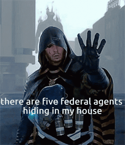 A Man In A Hooded Cape With The Words There Are Five Federal Agents Hiding In My House GIF