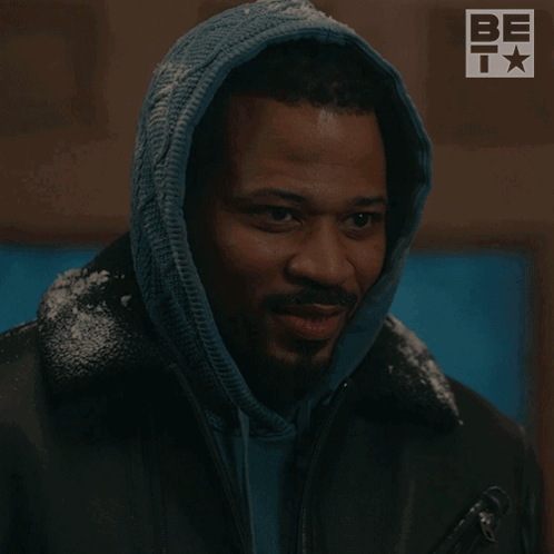 A Man In A Hooded Jacket Has The Word Magic On His Face GIF