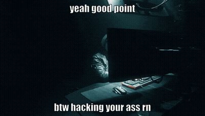 A Man In A Hooded Jacket Is Typing On A Computer With The Words Yeah Good Point Btw Hacking Your Ass GIF