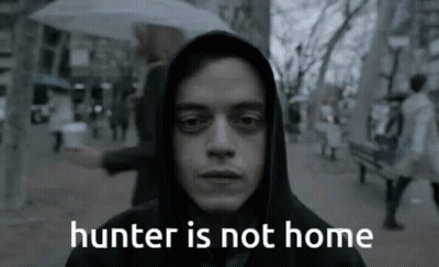A Man In A Hooded Jacket With The Words " Hunter Is Not Home " On The Bottom GIF