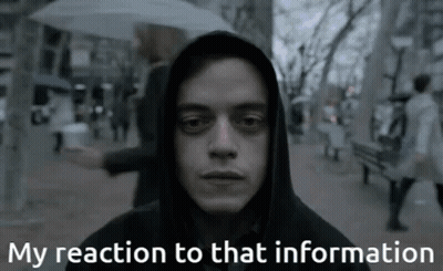 A Man In A Hooded Jacket With The Words My Reaction To That Information Below Him GIF