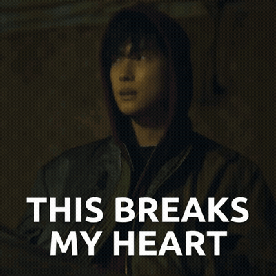 A Man In A Hooded Jacket With The Words This Breaks My Heart GIF