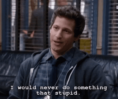 A Man In A Hoodie And Tie Is Sitting On A Couch And Saying `` I Would Never Do Something That Stupid . '' GIF