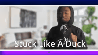 A Man In A Hoodie Is Dancing In A Living Room With The Words `` Stuck Like A Duck '' . GIF