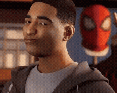 A Man In A Hoodie Is Standing In Front Of A Spiderman Mask . GIF
