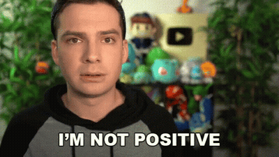 A Man In A Hoodie Says I 'M Not Positive In Front Of A Shelf Full Of Stuffed Animals . GIF