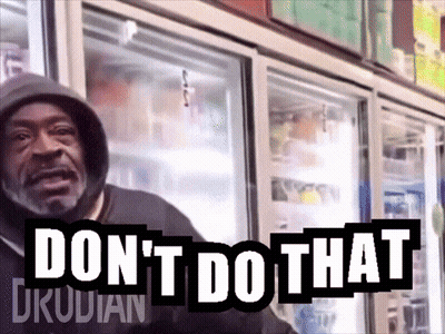 A Man In A Hoodie Stands In Front Of A Refrigerator With The Words " Don 'T Do That " On It GIF