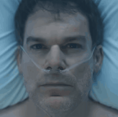 A Man In A Hospital Bed With An Oxygen Mask On His Nose GIF