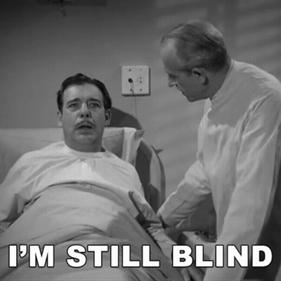 A Man In A Hospital Bed With The Words I 'M Still Blind GIF