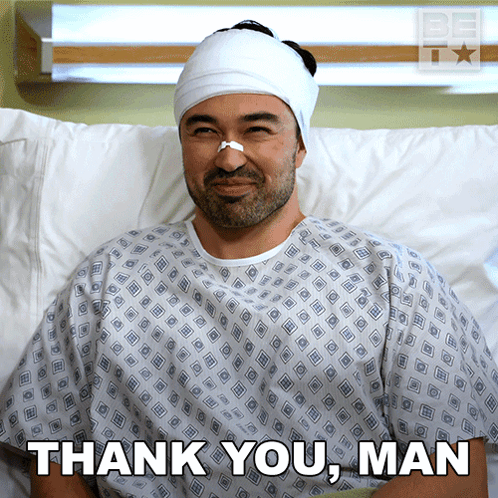 A Man In A Hospital Gown With A Bandage On His Head And The Words Thank You Man Below Him GIF