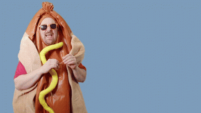 A Man In A Hot Dog Costume Says Cash Mon-Ay On A Blue Background GIF