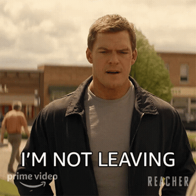 A Man In A Jacket Says " I 'M Not Leaving " On A Screen GIF