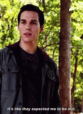 A Man In A Jacket Says It 'S Like They Expected Me To Be Evil In Front Of Trees GIF