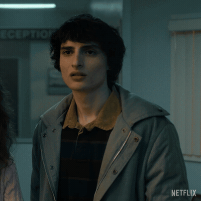 A Man In A Jacket Says " What Now " GIF