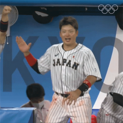 A Man In A Japan Jersey Is Dancing In The Dugout GIF