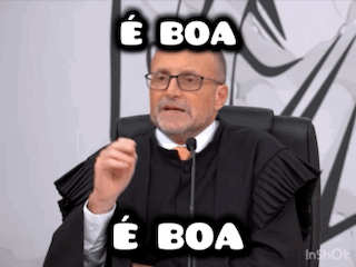 A Man In A Judge 'S Robe Is Sitting In Front Of A Microphone And Making A Funny Face . GIF