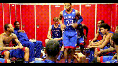 A Man In A Kansas Jersey Jumps In The Air GIF