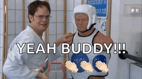 A Man In A Karate Uniform Is Putting A Helmet On Another Man GIF