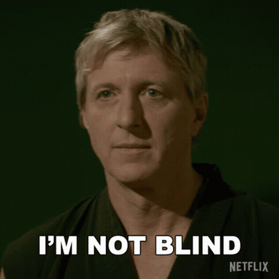 A Man In A Karate Uniform Says I 'M Not Blind On A Green Background GIF