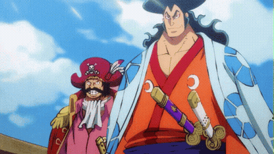 A Man In A Kimono Holds A Sword Next To A Man In A Red Hat With A Skull And Crossbones On It GIF