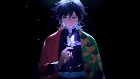 A Man In A Kimono Is Holding A Feather In His Hand . GIF