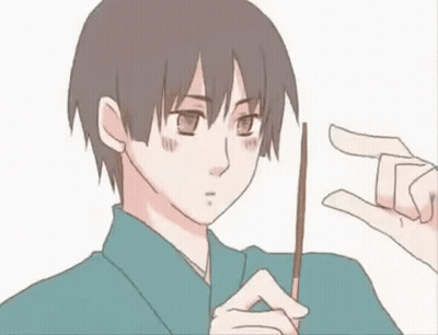 A Man In A Kimono Is Holding A Stick In His Hand And Making A Peace Sign . GIF