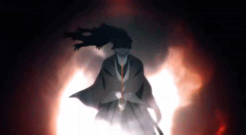 A Man In A Kimono Is Standing In A Dark Room With A Sword In His Hand . GIF