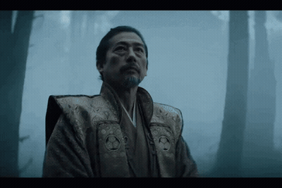 A Man In A Kimono Stands In A Foggy Forest Looking Up GIF