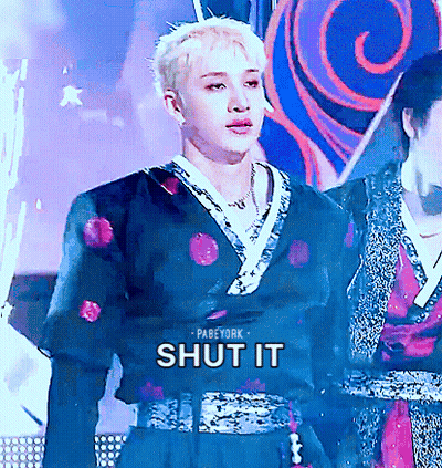 A Man In A Kimono With The Words Shut It On The Bottom GIF