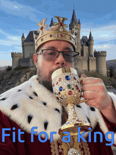 A Man In A King Costume Drinking From A Goblet With The Words Fit For A King Written Below Him GIF