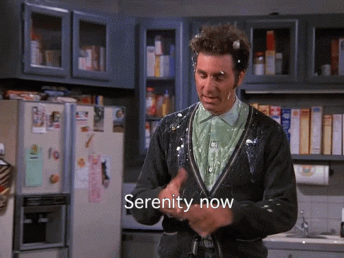 A Man In A Kitchen With Serenity Now Written In The Corner GIF