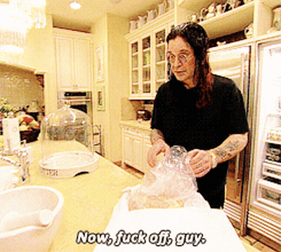 A Man In A Kitchen With The Words Now Fuck Off Guy Written On It GIF
