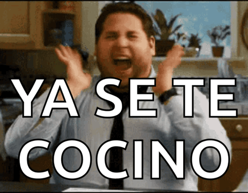 A Man In A Kitchen With The Words Ya Se Te Cocino Written Above Him GIF