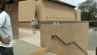 A Man In A Kms Shirt Stands Next To A Man In A Perchi Shirt GIF