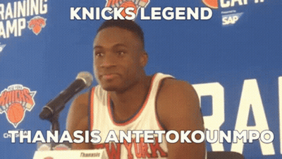 A Man In A Knicks Jersey Stands In Front Of A Microphone With The Caption Knicks Legend GIF
