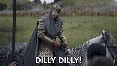 A Man In A Knight 'S Armor Is Riding A Horse And Saying `` Dilly Dilly '' . GIF