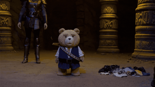 A Man In A Knight 'S Armor Is Standing In Front Of A Large Explosion GIF