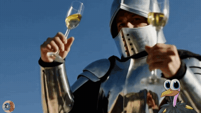 A Man In A Knight 'S Helmet Holds A Glass Of Wine GIF
