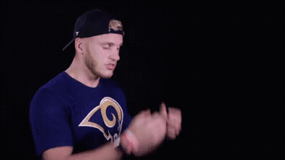 A Man In A La Rams Shirt Says It 'S A Catch In White Letters GIF