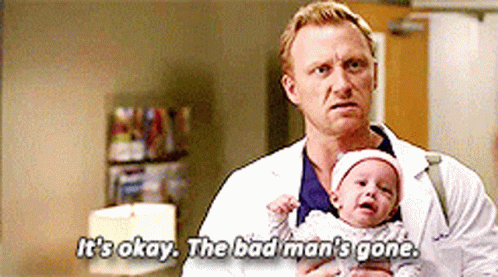 A Man In A Lab Coat Holding A Baby And Saying It 'S Okay The Bad Man 'S Gone GIF