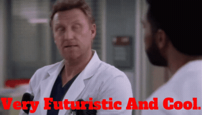 A Man In A Lab Coat Is Talking To Another Man With The Words Very Futuristic And Cool Behind Him GIF