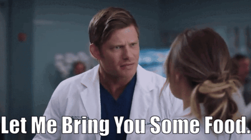 Man In Lab Coat Offering Food GIF